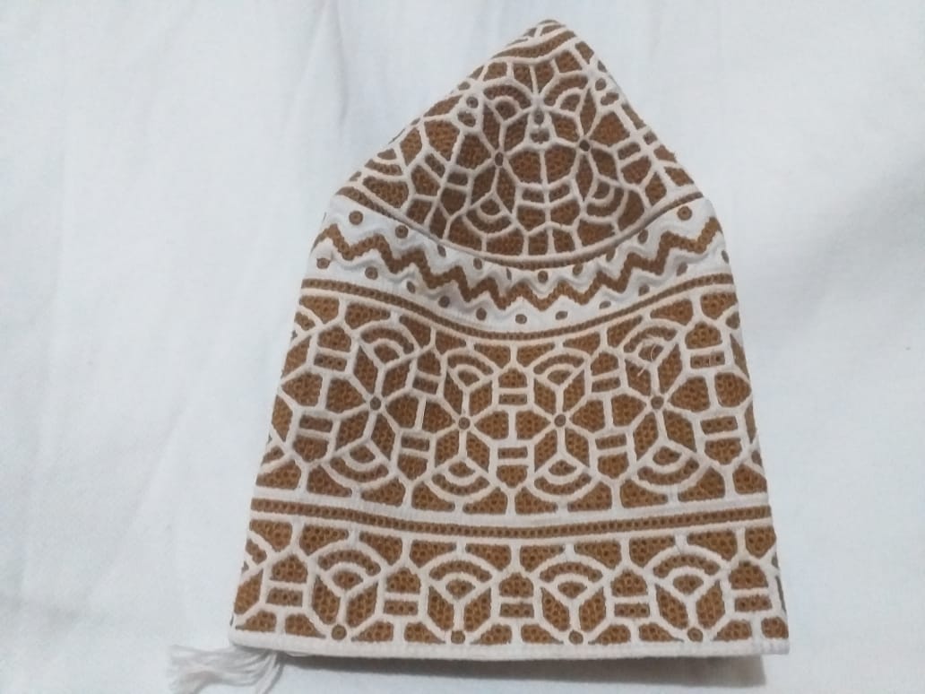 Traditional Omani Kumma Cap Enhanced by Modern Computer Embroidery